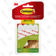 3M’s Command Strips let you hang pictures directly on the wall without leaving behind any nail holes or residue.